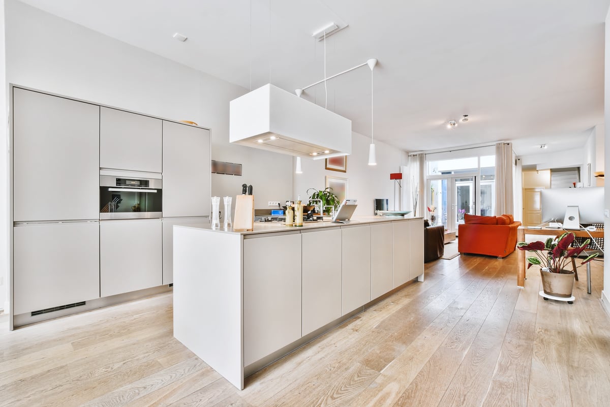 Modern white kitchen in open plan room